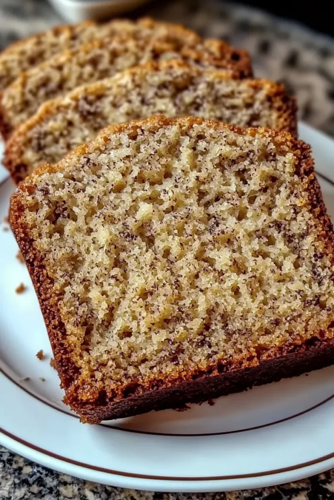 Close-up of sliced banana bread with a soft texture.