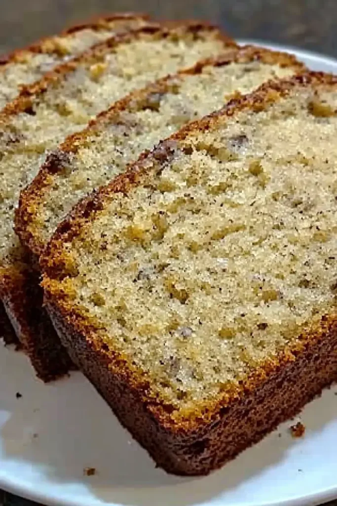 Plain sliced banana bread with a fluffy texture.