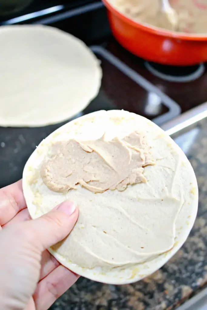 Filling the tortillas with cream cheese mixture