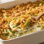 Freshly baked green bean casserole recipe with crispy fried onions.